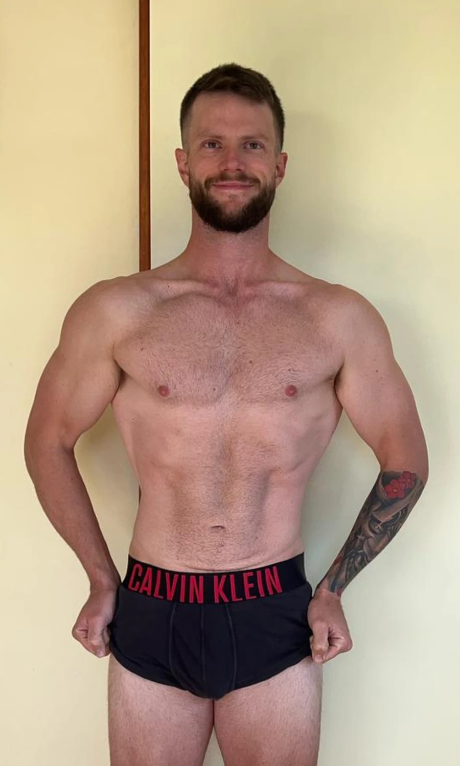 Rob after 9 months, 16kg lighter, holding his waistband